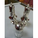 2 matching silver plated sugar shakers and one other