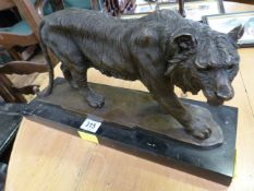 A bronze of a Tiger on plinth