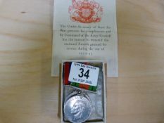 Two WW2 medals- The Defence medal and the War medal in a box addressed to G T Dunn