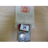 Two WW2 medals- The Defence medal and the War medal in a box addressed to G T Dunn