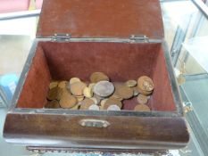 Quantity of various coins in a wooden casket