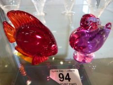 A Baccarat amethyst coloured bird and a Daum ruby angel fish