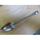 A large hallmarked silver serving spoon