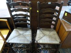 A pair of 19th century oak ladderback chairs