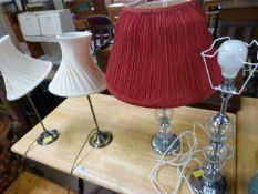 A pair of brass lamps and a pair of modern glass balled lamps