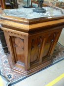 A pine gothic style lectern with marble top