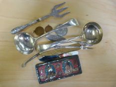 Small quantity of ladles, silver handled fork, medallions etc.