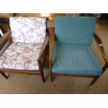 A pair of retro wooden framed armchairs