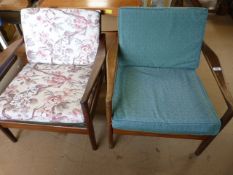 A pair of retro wooden framed armchairs