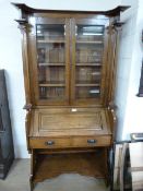 An oak arts and crafts bureau bookcase