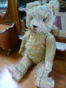 A vintage Teddy Bear with growler