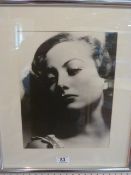 Joan Crawford, portrait by Clarence Sinclair Bull, blind embossed. 11 inches x 14 inches.