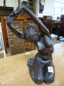 A modern bronze of a stretching nude lady indstinctly signed ( T L G?)