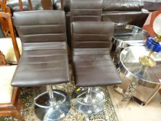 Set of three brown leather and chrome bar stools