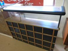 A mid century bar with vinyl front and lattice work decoration