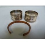 A Pair of hallmarked silver napkin rings - 50g and a Sabona copper bracelet