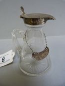 A Silver mounted whisky Tot with label - Birmingam 1910