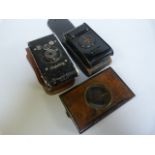 A Lantern case, Piccolette Camera in case and one other