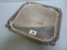 A hallmarked silver serving tray- weight 1024g approx.