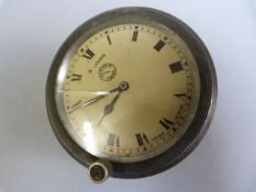 A Jaeger 8 day car clock,with side winder, the dial marked Jaeger,Paris, Fabrique en Suisse-glass