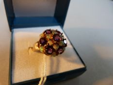 An Amethyst and opal ring, set in 9ct gold- size O 1/2