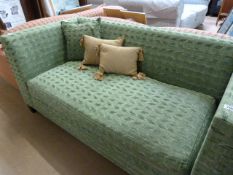 A green upholstered day bed