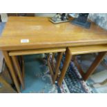 A Mckintosh teak nest of three tables