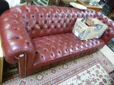 A Red leather chesterfield sofa