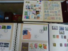 2 stamp albums and a quantity of first day covers