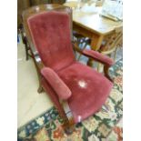 A red upholstered Grandfather chair