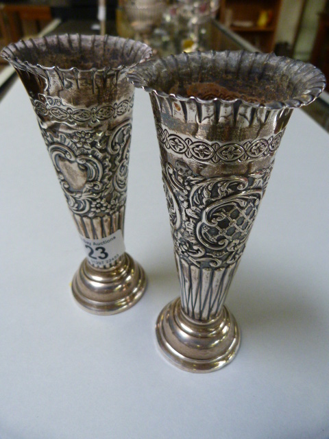 A pair of Hallmarked Silver weighted bud vases marked London 1895
