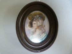 A portrait miniature of a lady, signed Petit