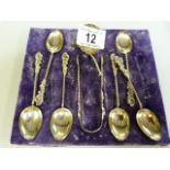 A part hallmarked silver set of coffee spoons and sugar nips ( sugar ladle damaged)