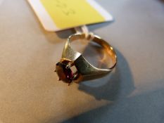 A garnet ring set on 9ct gold- size K 1/2, total weight 2.8g