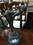 An Art Deco Style bronze of a lady doubled over