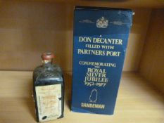 A Sandeman Don Decanter filled with Partners Port - commemorating the Royal Silver Jubilee 1952 -