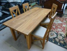 A kitchen table four chairs