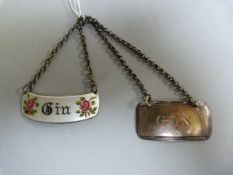 A Hallmarked silver and enamelled 'Gin' label along with another hallmarked silver 'Gin' label