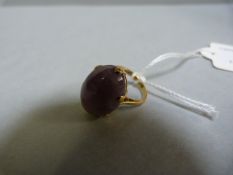 A 9ct ring with amethyst coloured stone