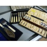 Small quantity of silverplate cutlery and a hallmarked silver mounted set of serving Knives