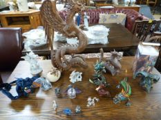 A quantity of dragon figures to include a large carved dragon