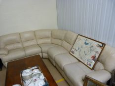 A cream leather corner cofa