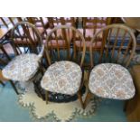 A Set of three ercol stickback chairs