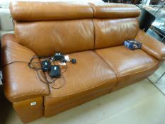 A Three seater tan leather reclining sofa