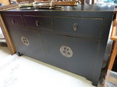 An oriental style black lacquered sideboard