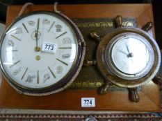 A Barometer and a hanging clock depicting the star signs