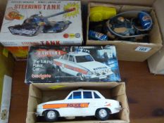 Vintage remote controlled steering tank and a Talking Police car