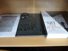 A Ouija Board with glass cover and a book on the Art of Tim Burton