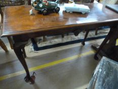 A Mahogany centre table on cabriole legs