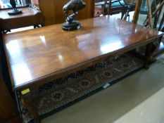 A large mahogany coffee table on cabriole legs